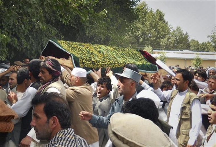 Mourners carry the covered coffin of Gen. Daud Daud during his funeral ceremony in Farkhar, Takhar north of Kabul, Afghanistan. Daud, an ethnic Tajik, was the fifth minority leader slain by militants in recent months. 